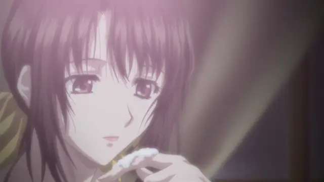 An anime girl with long brown hair and large brown eyes gazes forward while holding a piece of food to her mouth. Screenshot from Kara no Shoujo - Episode 1