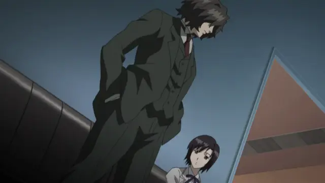 A tall man in a dark suit towers over a small girl with short dark hair in a school uniform, looking down at her sternly in a modern indoor setting. Screenshot from Kara no Shoujo - Episode 1