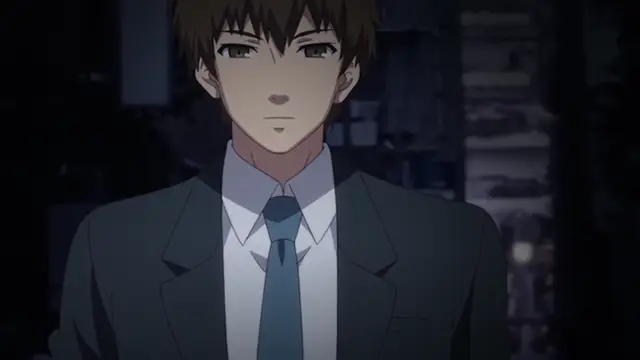 A young man with brown hair and a serious expression wears a dark suit, white shirt, and blue tie while standing in a dimly lit room. Screenshot from Ore ga Kanojo o ***su Wake - Episode 4