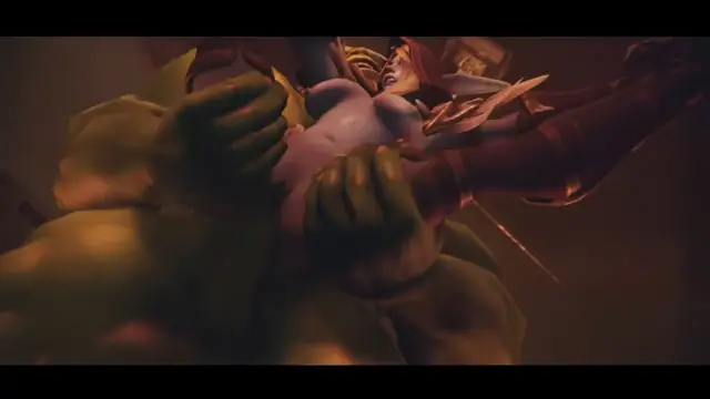 A large, muscular green ogre-like creature holds a scantily clad female warrior horizontally against its chest while they are both in a dimly lit room. Screenshot from Coronation