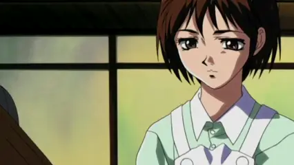 A close-up shot of a girl with short brown hair and a yellow headband, wearing a light green shirt and a white apron, looking down with a somber expression. Screenshot from Hana Dorei - Episode 1