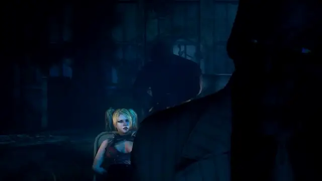 A blonde woman in a red lingerie outfit sits bound and gagged in a chair while a man in a suit stands over her in a dark, dimly lit room. Screenshot from Scarlet Nights