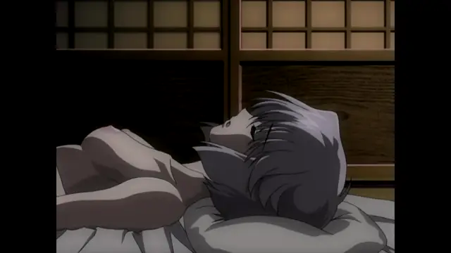 A female character with long grey hair lies on her side on a bed, facing away from the camera with her back exposed. Screenshot from Nee Chanto Shiyou Yo! - Episode 2
