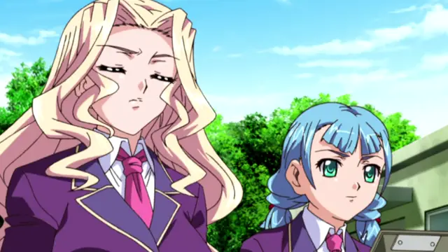 A tall, blonde woman in a purple school uniform stands with a bored expression next to a short, blue-haired girl in a matching uniform outdoors. Screenshot from Saimin Ryoujoku Gakuen - Episode 3