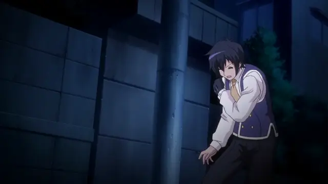 A young man with dark hair, wearing a school uniform with a blue vest and tie, stands leaning against a pole in an alleyway at night with a shocked or distressed expression. Screenshot from Kotowari - Episode 2