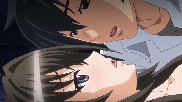 A close-up shot shows a male character with dark hair leaning over a girl with long brown hair, who appears to be lying down and looking up at him with a dazed expression. Screenshot from Kotowari - Episode 2