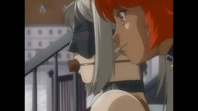 A close-up shot shows a red-haired woman with a mischievous smile leaning in towards a woman wearing a black mask and a brown choker, who appears to be being restrained or teased in an intimate setting. Screenshot from Himekishi Lilia - Episode 1