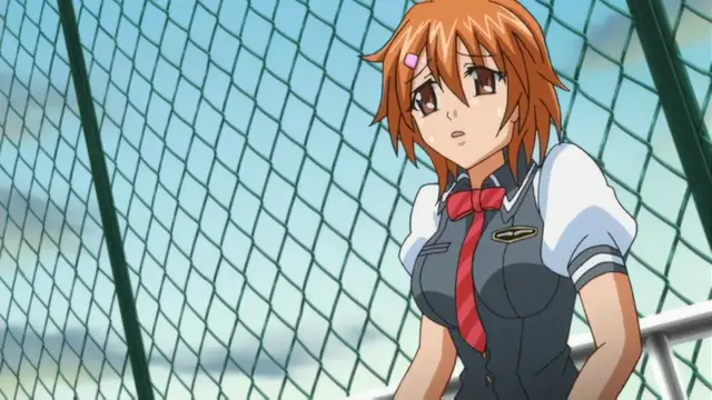 A schoolgirl with orange hair and a worried expression stands behind a chain-link fence, wearing a dark blue uniform with a red ribbon. Screenshot from Kansen Inyoku no Rensa - Episode 2