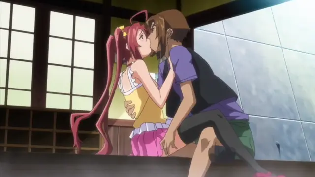 A girl with long pink hair and twin tails wearing a yellow top and pink skirt is kissing a man with brown hair and a flat hat while sitting in what appears to be a public bathhouse. Screenshot from Hitou Meguri Kakure Yu Mao Hen - Episode 1