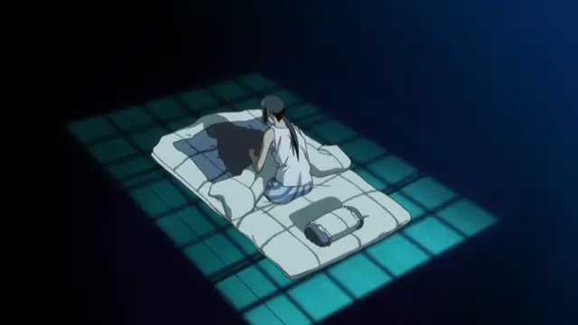 A girl with long black hair sits on a futon in a dark room, illuminated by a grid of blue light from a window, looking down sadly. Screenshot from Hitou Meguri Kakure Yu - Episode 2