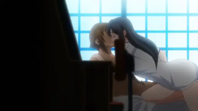 A woman with long dark hair in a white dress sits on the lap of a man with short brown hair while they engage in a passionate kiss in front of a Japanese-style sliding door. Screenshot from Hitou Meguri Kakure Yu - Episode 2