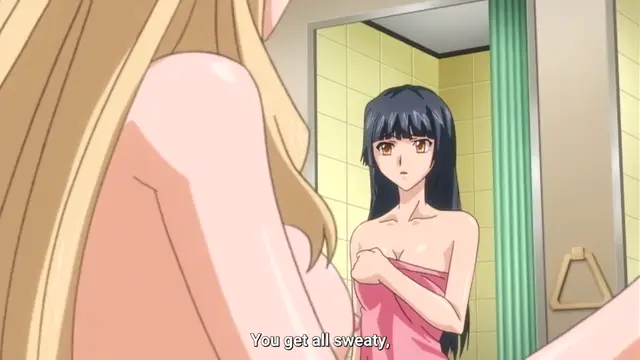 A blonde girl and a dark-haired girl in a bathroom, with the dark-haired girl wrapped in a towel looking surprised, as a subtitle at the bottom reads "You get all sweaty,". Screenshot from Last Waltz - Episode 1