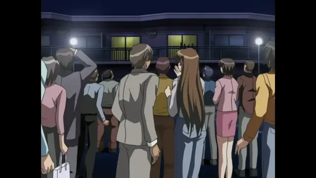A crowd of people in business attire stands outside a building at night, with a man in a gray suit facing a woman with long brown hair. Screenshot from Foxy Nudes - Episode 1