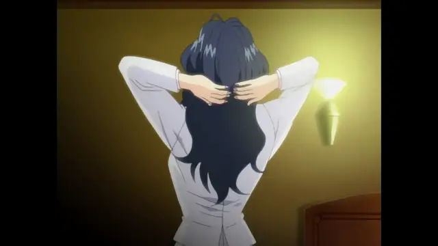 A girl with long dark hair is seen from behind, wearing a white button-down shirt, holding her hands to the sides of her head as if in distress or surprise. Screenshot from Foxy Nudes - Episode 1
