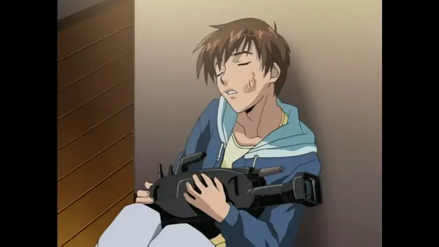 A distressed young man with brown hair sits slumped against a wall, clutching a large black assault rifle and looking exhausted or injured. Screenshot from Foxy Nudes - Episode 2