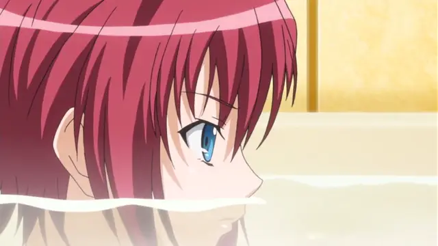A close-up anime shot of a red-haired girl with blue eyes relaxing in a bath with her head partially submerged in water. Screenshot from Wana Hakudaku Mamire no Houkago - Episode 1