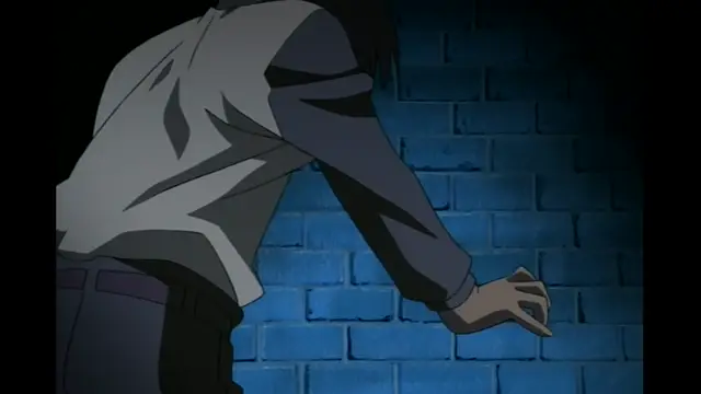 A male anime character with black hair leans forward against a blue brick wall, reaching his hand out toward the camera. Screenshot from Elfina: Yoru e to Urareta Oukoku de... - Episode 3