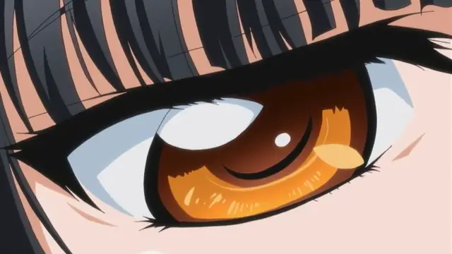A close-up shot focuses on a woman's large brown eye with thick lashes and detailed highlights, featuring a small tear welling in the corner. Screenshot from Rin x Sen - Episode 2