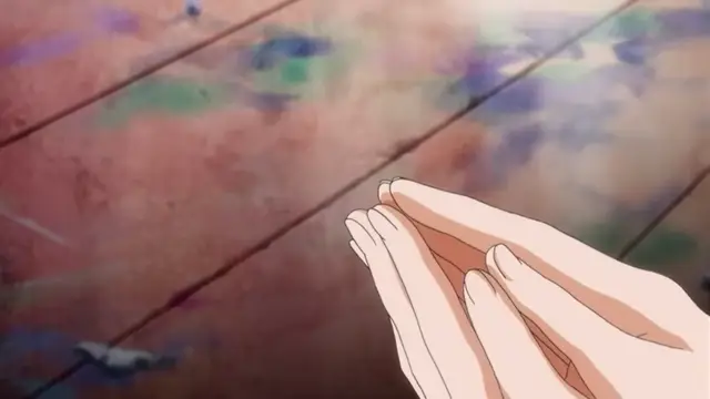 A close-up shot features a pair of pale, slender anime hands pressed together in a prayer-like gesture against a textured, multicolored wooden floor. Screenshot from Rin x Sen - Episode 2