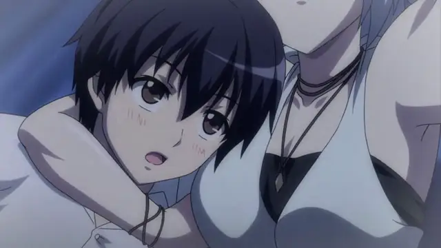 A blushing anime boy with black hair is being held from behind by a woman in a white top who has her arm around his shoulder. Screenshot from Tropical Kiss - Episode 3