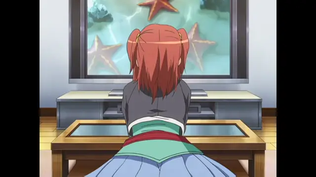 A girl with red hair tied in pigtails sits on the floor, facing away from the viewer, looking at a television screen showing a large starfish and several other starfish in an aquarium. Screenshot from Cafe Junkie - Episode 2