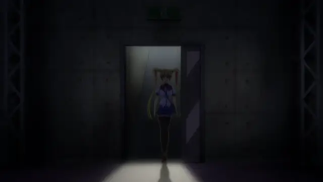 A young anime girl with long pigtails, wearing a purple and white school uniform, stands alone in a dimly lit, industrial-looking hallway with a spotlight shining on her as she enters through a doorway. Screenshot from Inshitsu Otaku ni Ikareru Kanojo - Episode 3