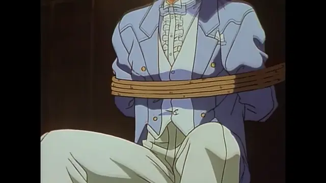 A man in a blue suit and white shirt is tied up with a thick wooden plank around his waist as he sits on the floor. Screenshot from Imma Youjo: The Erotic Temptress - Episode 2