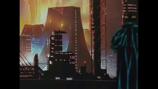 A futuristic, neon-lit cityscape at night features towering skyscrapers and a large, triangular building under a hazy orange sky, viewed from a dark balcony next to a person in a blue outfit. Screenshot from Imma Youjo: The Erotic Temptress - Episode 2