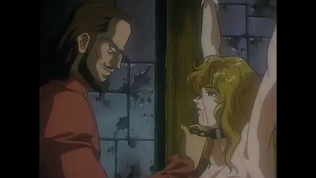 A man with a beard and a smug expression stands before a blonde woman with her hands bound above her head against a stone wall, as he holds her chin while she looks at him with a tearful expression. Screenshot from Imma Youjo: The Erotic Temptress - Episode 4
