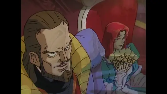 A man with long brown hair and a beard sits in a throne-like chair next to a woman with red hair wearing a gown and holding a fan. Screenshot from Imma Youjo: The Erotic Temptress - Episode 4