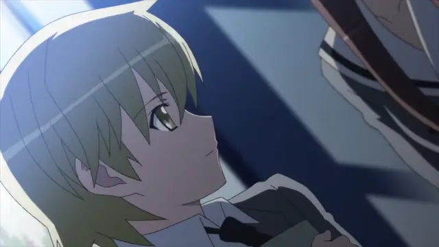 A close-up shot shows a young anime girl with short blonde hair looking up with a blushing face at an older woman standing in front of her. Screenshot from Aki Sora: In a Dream - Episode 1