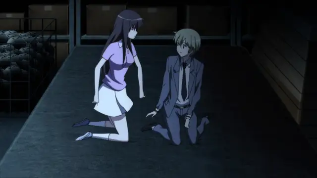 In a dimly lit room, a woman in a purple shirt and white skirt kneels on a gray floor facing a man in a suit who is also kneeling and looking up at her. Screenshot from Aki Sora: In a Dream - Episode 1