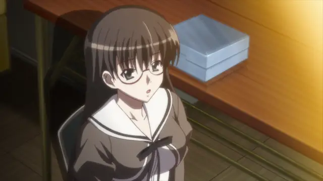A brown-haired girl wearing glasses and a sailor-style school uniform sits at a desk with a surprised expression. Screenshot from Aki Sora: In a Dream - Episode 1