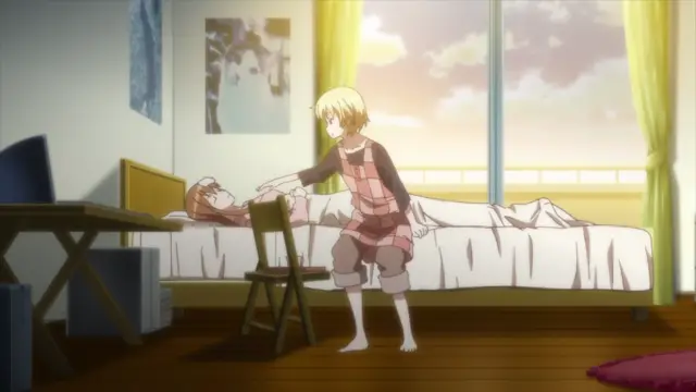 A blonde anime girl in a pink plaid outfit stands over a reclining woman on a bed in a bedroom, appearing to wake her up or check on her. Screenshot from Aki Sora: In a Dream - Episode 1