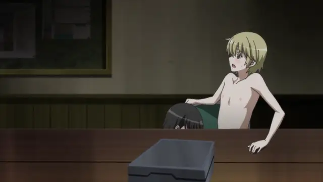 A blonde anime boy with wide eyes sits shirtless at a wooden table next to a black-haired boy who is leaning forward, both appearing shocked or startled. Screenshot from Aki Sora: In a Dream - Episode 2