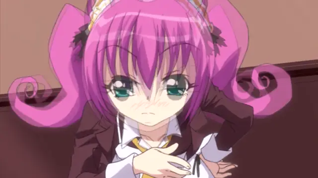 A blushing anime girl with pink hair and large green eyes wears a school uniform while looking embarrassed. Screenshot from Oshiete Re Maid - Episode 1