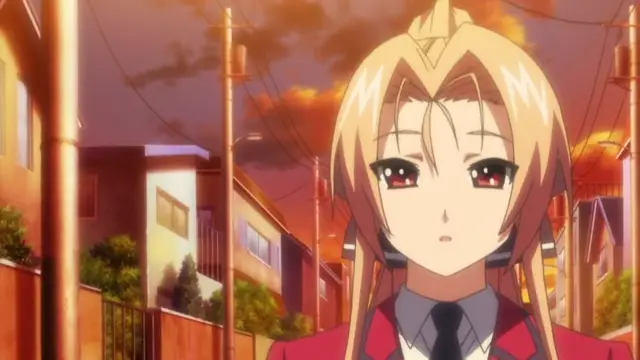 A blonde anime girl with red eyes and a worried expression stands in a residential neighborhood at sunset, wearing a red school uniform with a black tie. Screenshot from Menkui! - Episode 1