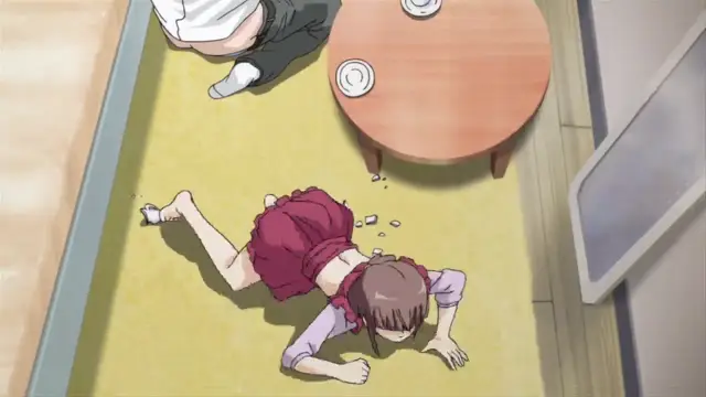 From an overhead perspective, a girl in a purple school uniform lies face down on a tatami mat, while a male student sits on the floor next to a low table with two cups. Screenshot from Nozoki Ana