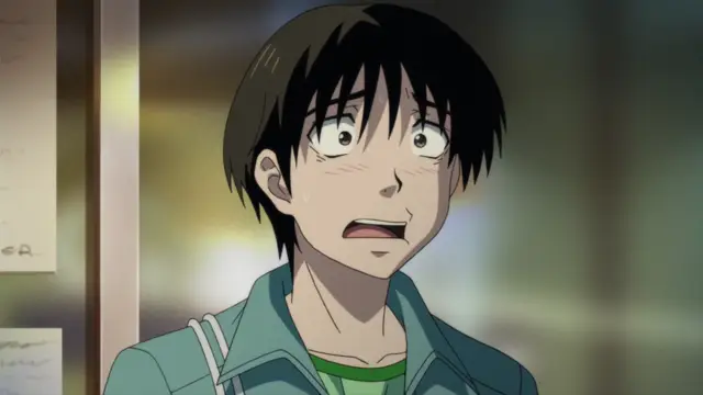 A shocked and blushing anime boy with black hair and wide eyes looks on in a classroom setting. Screenshot from Nozoki Ana