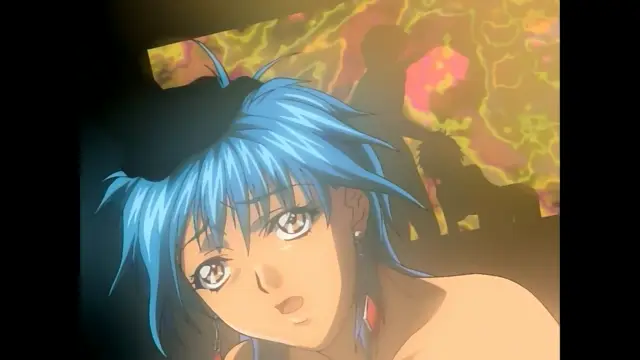 A close-up shot shows an anime girl with blue hair and large eyes looking surprised or dazed while standing in front of a colorful, abstract background. Screenshot from Slave Nurses - Episode 1