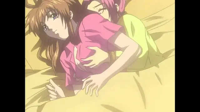 A girl with long brown hair lies on a bed in a pink shirt while being held and kissed by a girl with short pink hair wearing a yellow shirt. Screenshot from Slave Nurses - Episode 2