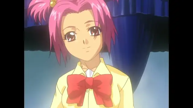 A close-up shot of a girl with pink hair and a red bow on her yellow school uniform looking forward with a slight smile. Screenshot from Slave Nurses - Episode 3