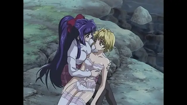 A tall girl with long purple hair and a school uniform leans over and kisses a blonde girl wearing a white corset and lingerie who is standing in front of a rocky shore. Screenshot from Moonlight Lady - Episode 2
