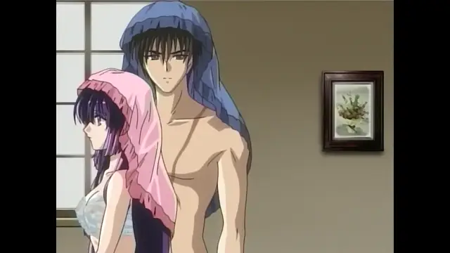 A tall, shirtless man with a blue head covering stands behind a woman in a bikini, who is draped in a pink towel, while they both look toward the left side of the frame. Screenshot from Moonlight Lady - Episode 5