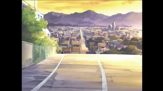 An anime-style cityscape at sunset with mountains in the background, viewed from an elevated rooftop or balcony. Screenshot from Bible Black - Episode 1