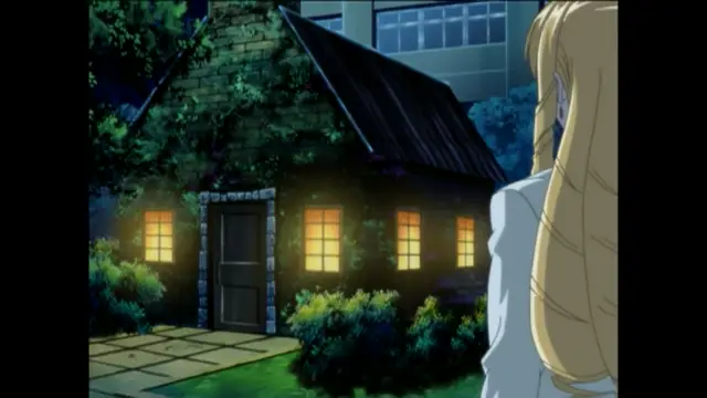 A blonde woman in a white dress stands in the foreground looking towards a small, ivy-covered cottage with lit windows at night. Screenshot from Bible Black New Testament - Episode 3