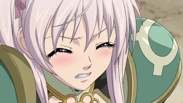 A close-up shot of an anime girl with long light-purple hair and blushing cheeks grimaces with her teeth bared while wearing a green and gold outfit. Screenshot from Ikusa Otome Suvia - Episode 3