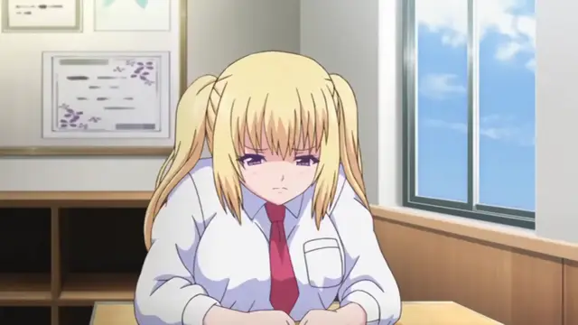 A blonde anime girl with twin tails wearing a school uniform sits at a desk with a frustrated and blushing expression in a classroom. Screenshot from Papa Katsu! - Episode 1