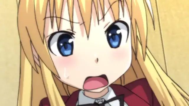An anime girl with long blonde hair, blue eyes, and a shocked expression wears a red school uniform with a white collar and a black bow. Screenshot from Koiito Kinenbi - Episode 1
