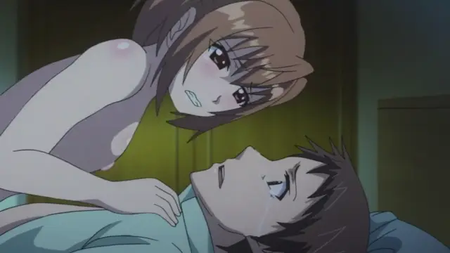 A blushing anime girl with large breasts leans over a crying, lying male character in an intimate bedroom setting. Screenshot from Otome Dori - Episode 2